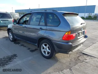2003 BMW X5 3.0i with VIN 5UXFA53573LV83812, listed as a IAAI auction lot 41590046 with 166,841 mi miles. Bid and sale history available at carsss.com. Image 3.