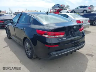 2019 Kia Optima S with VIN 5XXGT4L34KG296953, listed as a IAAI auction lot 42014999 with 64,968 mi miles. Bid and sale history available at carsss.com. Image 3.
