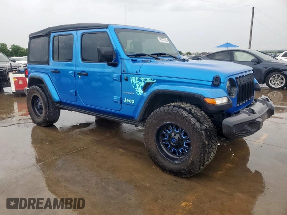 2023 Jeep Wrangler Sahara with VIN 1C4HJXEG7PW590252, listed as a Copart auction lot 59377765 with 32,689 mi miles and Salvage title. Bid and sale history available at DreamBid. Image 4.