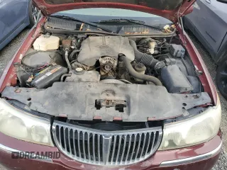 2001 Lincoln Town Car Cartier z VIN 1LNHM83WX1Y732737, wystawiony jako Copart lot #48216445 z przebiegiem 103 262 mil mil oraz Szkoda całkowita • Salvage title. Historia ofert i sprzedaży dostępna na DreamBid. Obrazek 11.