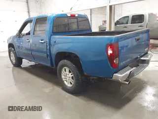 2011 GMC Canyon SLT with VIN 1GTH6NFP8B8115436, listed as a IAAI auction lot 41676023 with 148,478 mi miles. Bid and sale history available at carsss.com. Image 3.