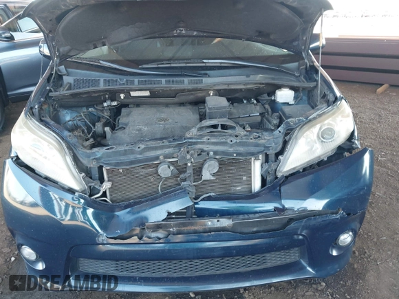 2012 Toyota Sienna SE with VIN 5TDXK3DC0CS264643, listed as a IAAI auction lot 42004082 with 118,675 mi miles. Bid and sale history available at carsss.com. Image 10.