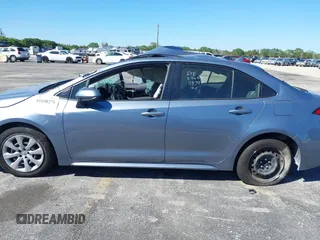 2021 Toyota Corolla LE with VIN JTDEPMAE6MJ118797, listed as a IAAI auction lot 41698276 with 52,673 mi miles. Bid and sale history available at carsss.com. Image 15.