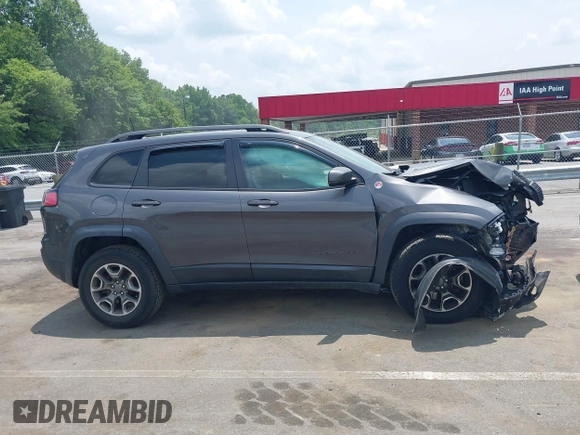 2020 Jeep Cherokee Trailhawk with VIN 1C4PJMBX5LD530720, listed as a IAAI auction lot 42404948 with 99,606 mi miles and . Bid and sale history available at DreamBid. Image 13.