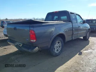 2003 Ford F-150 XL with VIN 1FTRX17W53NB00671, listed as a IAAI auction lot 41576739 with 194,066 mi miles. Bid and sale history available at carsss.com. Image 4.