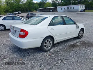 2004 Toyota Camry LE with VIN JTDBE32KX40279599, listed as a IAAI auction lot 42202160 with 288,879 mi miles and . Bid and sale history available at carsss.com. Image 4.