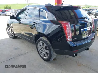 2012 Cadillac SRX Premium Collection z VIN 3GYFNCE36CS615725, wystawiony jako IAAI lot #42738584 z przebiegiem 156 625 mil mil oraz . Historia ofert i sprzedaży dostępna na DreamBid. Obrazek 3.