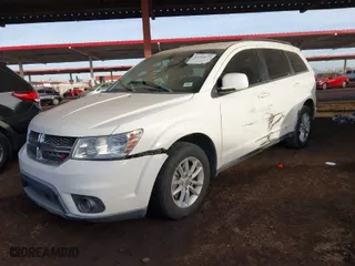 2013 Dodge Journey SXT with VIN 3C4PDCBG0DT701676, listed as a IAAI auction lot 41214275 with 144,196 mi miles. Bid and sale history available at carsss.com. Image 2.