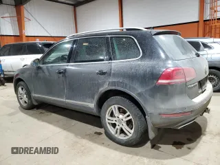 2013 Volkswagen Touareg Sport с VIN WVGEP9BP5DD008301, выставлен на аукционе Copart как лот 85085984 с пробегом 204 735 миль миль и Списание • Salvage title. История ставок и продаж доступна на DreamBid. Изображение 2.