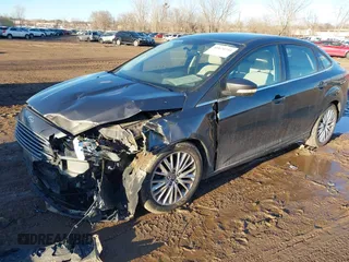 2015 Ford Focus Titanium with VIN 1FADP3J28FL348625, listed as a IAAI auction lot 41674741 with 223,585 mi miles and . Bid and sale history available at carsss.com. Image 2.