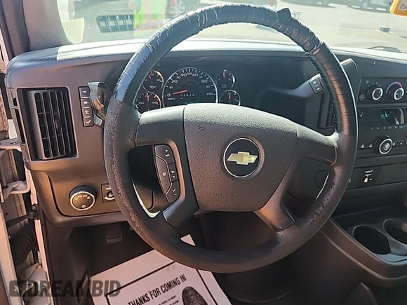 2014 Chevrolet Express Cargo with VIN 1GCWGFCG4E1148722, listed as a IAAI auction lot 42843884 with 188,945 mi miles and . Bid and sale history available at DreamBid. Image 3.