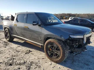 2023 Rivian R1T Adventure z VIN 7FCTGAAA1PN022134, wystawiony jako Copart lot #85545774 z przebiegiem 48 951 mil mil oraz Szkoda całkowita • Salvage title. Historia ofert i sprzedaży dostępna na DreamBid. Obrazek 4.