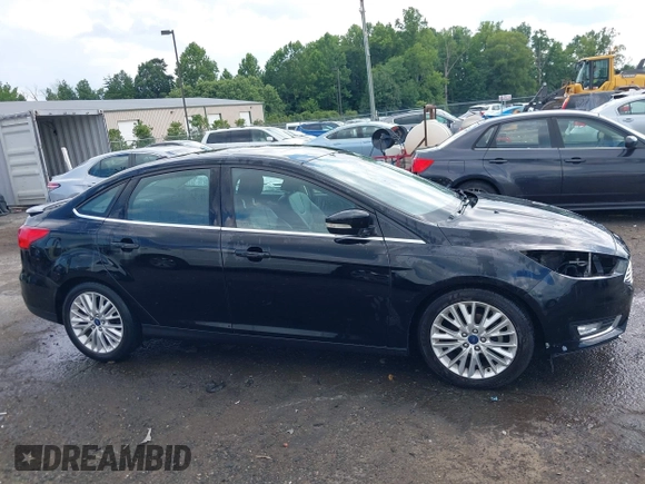 2016 Ford Focus Titanium z VIN 1FADP3J27GL215436, wystawiony jako IAAI lot #42709166 z przebiegiem 75 956 mil mil oraz . Historia ofert i sprzedaży dostępna na DreamBid. Obrazek 14.