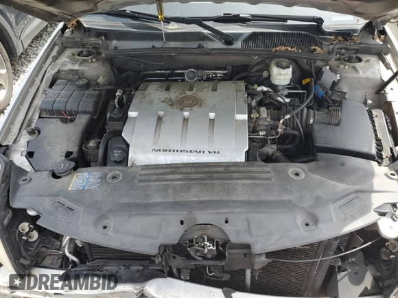 2006 Cadillac DTS 1SD z VIN 1G6KD57Y26U115094, wystawiony jako Copart lot #53534355 z przebiegiem 126 631 mil mil oraz Szkoda całkowita • Salvage title. Historia ofert i sprzedaży dostępna na DreamBid. Obrazek 11.