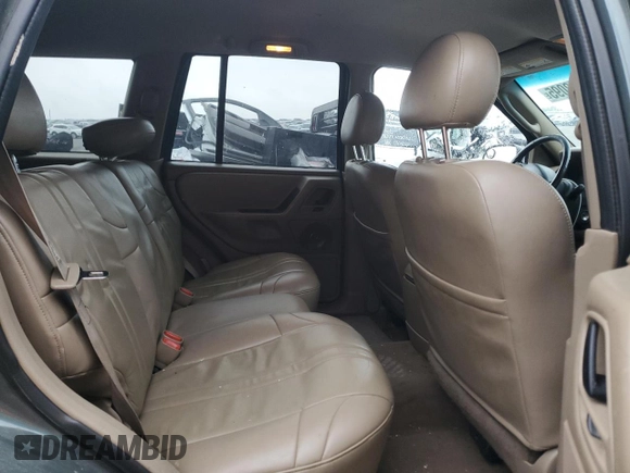 2002 Jeep Grand Cherokee z VIN 1J4GX38S72C152046, wystawiony jako Copart lot #57963095 z przebiegiem 204 576 mil mil oraz Szkoda całkowita • Salvage title. Historia ofert i sprzedaży dostępna na DreamBid. Obrazek 11.