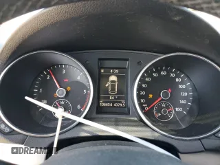 2014 Volkswagen Golf TDI w/Sunroof & Nav z VIN WVWNM7AJ2EW006137, wystawiony jako Copart lot #57031715 z przebiegiem 136 654 mil mil oraz Szkoda całkowita • Salvage title. Historia ofert i sprzedaży dostępna na DreamBid. Obrazek 9.