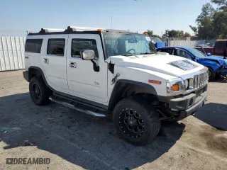 2005 Hummer H2 SUV with VIN 5GRGN23U35H132428, listed as a Copart auction lot 74594554 with 107,701 mi miles and Salvage Title. Bid and sale history available at carsss.com. Image 4.