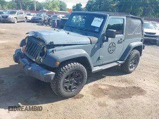 2015 Jeep Wrangler Freedom Edition with VIN 1C4AJWAG1FL714002, listed as a IAAI auction lot 42579024 with 98,732 mi miles and . Bid and sale history available at DreamBid. Image 18.