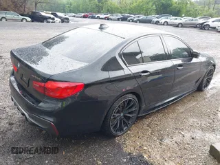 2018 BMW 5 Series M550i xDrive with VIN WBAJB9C5XJB286923, listed as a IAAI auction lot 42527301 with 76,923 mi miles and . Bid and sale history available at DreamBid. Image 4.