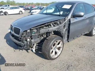 2014 BMW X6 xDrive35i z VIN 5UXFG2C57E0H10305, wystawiony jako IAAI lot #42109416 z przebiegiem 144 816 mil mil oraz . Historia ofert i sprzedaży dostępna na DreamBid. Obrazek 6.