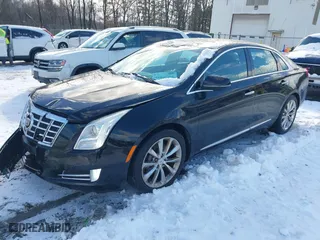 2013 Cadillac XTS Luxury with VIN 2G61R5S31D9106650, listed as a IAAI auction lot 41405091 with 143,545 mi miles. Bid and sale history available at carsss.com. Image 17.