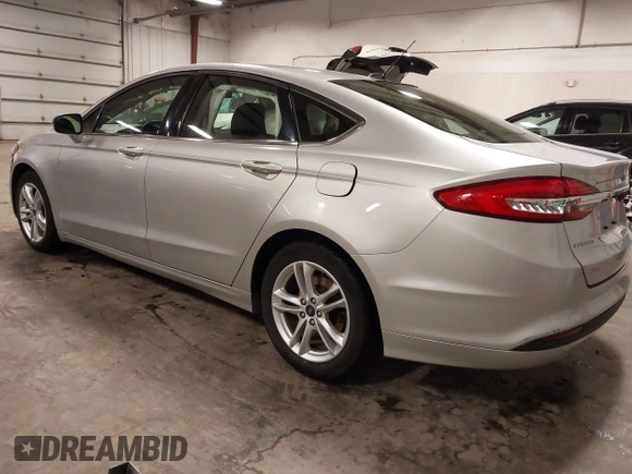 2018 Ford Fusion SE with VIN 3FA6P0HD1JR243112, listed as a IAAI auction lot 42256676 with 112,003 mi miles and . Bid and sale history available at DreamBid. Image 3.