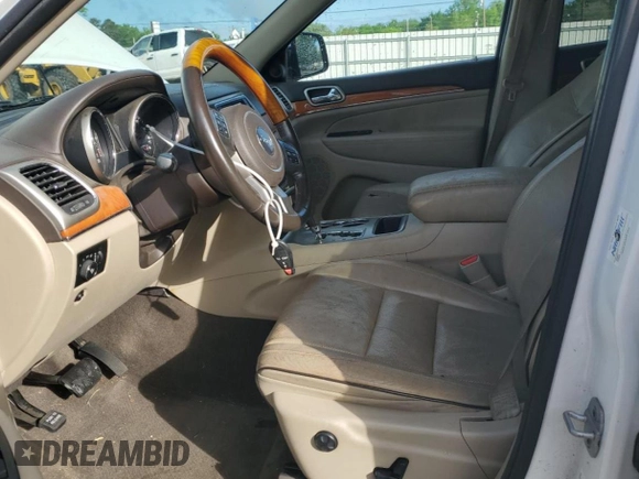 2013 Jeep Grand Cherokee Overland with VIN 1C4RJECG8DC526150, listed as a Copart auction lot 52038775 with 183,813 mi miles and Salvage Title. Bid and sale history available at DreamBid. Image 7.