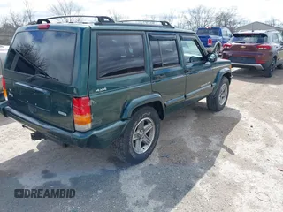 2000 Jeep Cherokee Classic with VIN 1J4FF58S3YL258755, listed as a IAAI auction lot 42020260 with 228,867 mi miles. Bid and sale history available at carsss.com. Image 4.