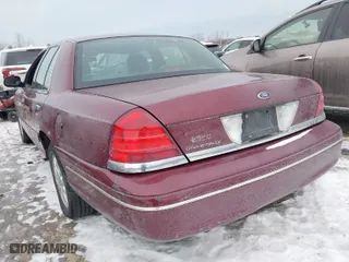 2004 Ford Crown Victoria LX with VIN 2FAFP74W14X128791, listed as a IAAI auction lot 41405101 with 137,091 mi miles. Bid and sale history available at carsss.com. Image 3.