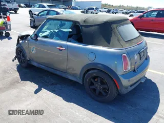 2005 MINI Convertible S with VIN WMWRH33545TF85051, listed as a IAAI auction lot 41843147 with 109,656 mi miles and . Bid and sale history available at DreamBid. Image 3.