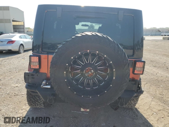2012 Jeep Wrangler Unlimited Sport with VIN 1C4BJWDG0CL200802, listed as a Copart auction lot 63822365 with 116,501 mi miles and Salvage title. Bid and sale history available at DreamBid. Image 6.