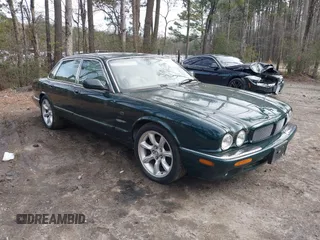 2003 Jaguar XJ with VIN SAJDA15B53MF53212, listed as a IAAI auction lot 41613266 with 180,165 mi miles and . Bid and sale history available at DreamBid. Image 1.