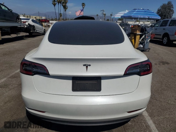 2023 Tesla Model 3 with VIN 5YJ3E1EA8PF394705, listed as a Copart auction lot 52319945 with 58,193 mi miles and Salvage title. Bid and sale history available at DreamBid. Image 6.