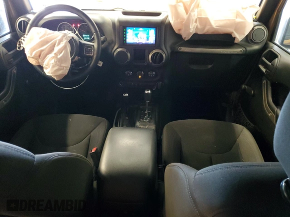 2015 Jeep Wrangler Unlimited Freedom with VIN 1C4BJWDG5FL713046, listed as a Copart auction lot 58563455 with 144,179 mi miles and Salvage title. Bid and sale history available at DreamBid. Image 8.