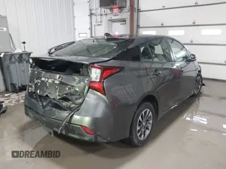 2021 Toyota Prius L Eco with VIN JTDKAMFU9M3132587, listed as a IAAI auction lot 41637275 with 84,203 mi miles. Bid and sale history available at carsss.com. Image 4.