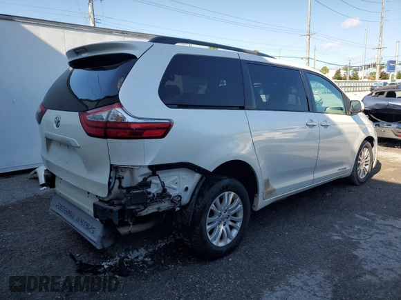 2015 Toyota Sienna XLE with VIN 5TDYK3DC0FS679812, listed as a Copart auction lot 61600775 with 118,483 mi miles and Salvage title. Bid and sale history available at DreamBid. Image 3.