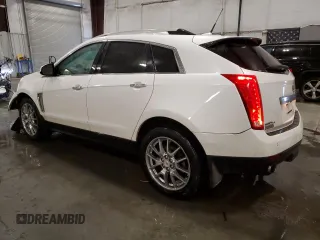 2014 Cadillac SRX Premium Collection z VIN 3GYFNGE36ES581361, wystawiony jako Copart lot #88540815 z przebiegiem 137 047 mil mil oraz Nie do naprawy. Historia ofert i sprzedaży dostępna na DreamBid. Obrazek 2.