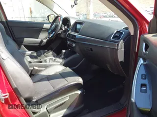 2016 Mazda CX-5 Grand Touring with VIN JM3KE2DY3G0686588, listed as a IAAI auction lot 41697312 with 65,090 mi miles. Bid and sale history available at carsss.com. Image 5.