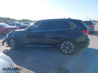 2018 BMW X5 xDrive40e iPerformance with VIN 5UXKT0C59J0W00801, listed as a IAAI auction lot 41081133 with 63,265 mi miles. Bid and sale history available at carsss.com. Image 15.