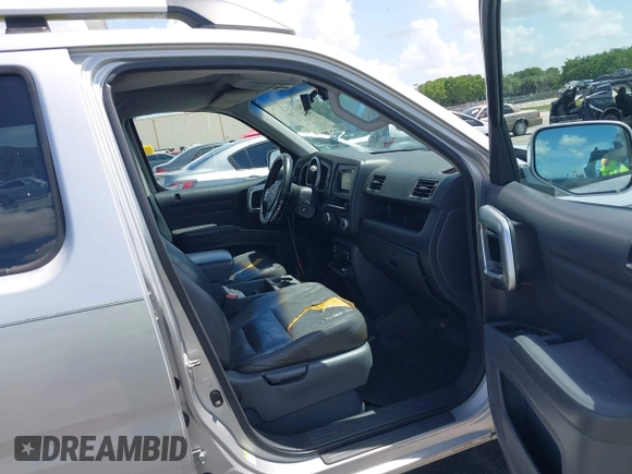 2007 Honda Ridgeline RTL z VIN 2HJYK16557H506463, wystawiony jako IAAI lot #42511456 z przebiegiem 133 701 mil mil oraz . Historia ofert i sprzedaży dostępna na DreamBid. Obrazek 5.