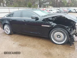 2011 Jaguar XJ with VIN SAJWA1CB8BLV05801, listed as a IAAI auction lot 41543833 with 104,434 mi miles and . Bid and sale history available at DreamBid. Image 1.