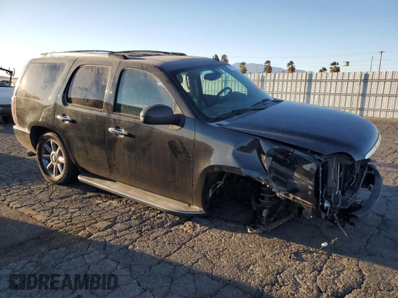 2013 GMC Yukon Denali with VIN 1GKS1EEF0DR205906, listed as a Copart auction lot 87969385 with 128,283 mi miles and Salvage Title. Bid and sale history available at carsss.com. Image 4.