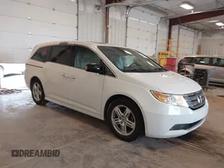 2013 Honda Odyssey Touring with VIN 5FNRL5H96DB039472, listed as a IAAI auction lot 42674580 with 174,914 mi miles and . Bid and sale history available at DreamBid. Image 1.