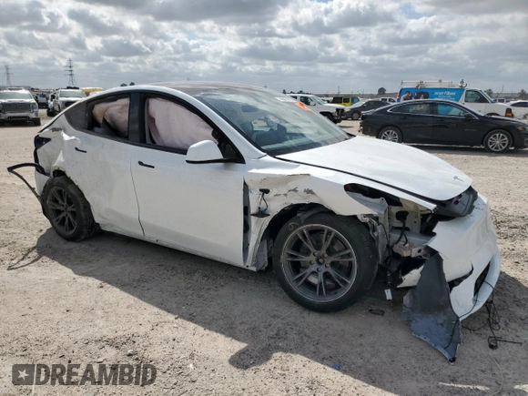 2024 Tesla Model Y Long Range with VIN 7SAYGDEE2RA335818, listed as a Copart auction lot 48821475 with 4,415 mi miles and Salvage Title. Bid and sale history available at DreamBid. Image 4.