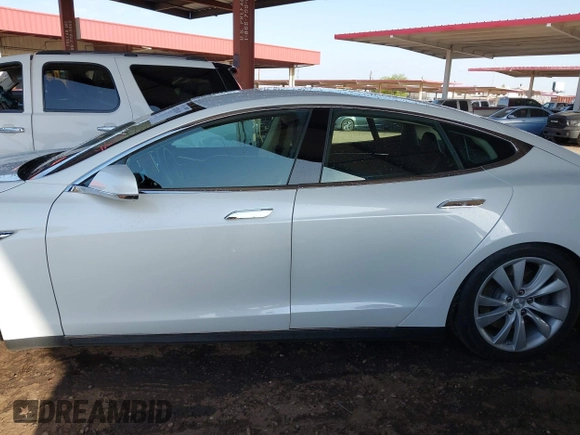 2014 Tesla Model S 60 with VIN 5YJSA1H14EFP63737, listed as a IAAI auction lot 41947610 with 62,240 mi miles and . Bid and sale history available at DreamBid. Image 14.