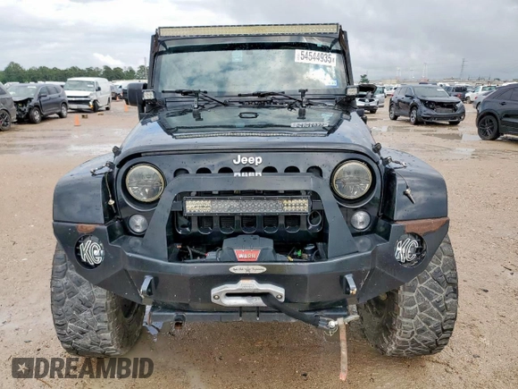 2015 Jeep Wrangler Unlimited Rubicon Hard Rock with VIN 1C4HJWFG1FL710264, listed as a Copart auction lot 54123285 with 96,737 mi miles and Salvage title. Bid and sale history available at DreamBid. Image 5.