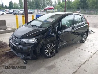 2015 Honda Fit EX-L z VIN 3HGGK5H81FM701122, wystawiony jako IAAI lot #42610165 z przebiegiem 74 969 mil mil oraz . Historia ofert i sprzedaży dostępna na DreamBid. Obrazek 18.
