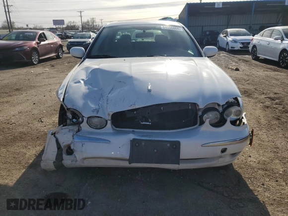 2007 Jaguar X-Type z VIN SAJWA51A07WJ14424, wystawiony jako Copart lot #84556864 z przebiegiem Nie podano mil oraz Szkody całkowita. Historia ofert i sprzedaży dostępna na DreamBid. Obrazek 5.