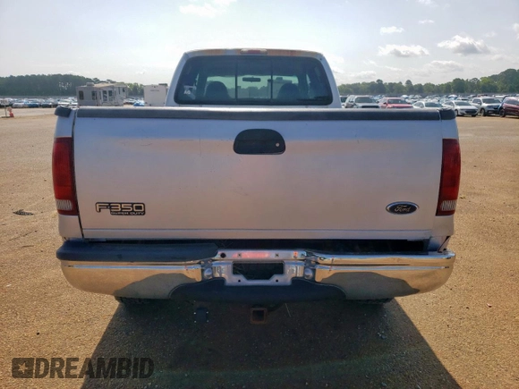 1999 Ford F-350 XL with VIN 1FTSW31S2XEE89071, listed as a Copart auction lot 61016685 with 115,130 mi miles and Salvage title. Bid and sale history available at DreamBid. Image 6.