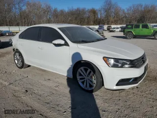 2019 Volkswagen Passat 2.0T Wolfsburg Edition with VIN 1VWLA7A31KC014502, listed as a Copart auction lot 82886864 with 77,181 mi miles and Salvage Title. Bid and sale history available at carsss.com. Image 4.